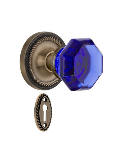 Rope Rosette Mortise Lock Set with Colored Waldorf Crystal Glass Knobs Cobalt Blue in Antique Brass.